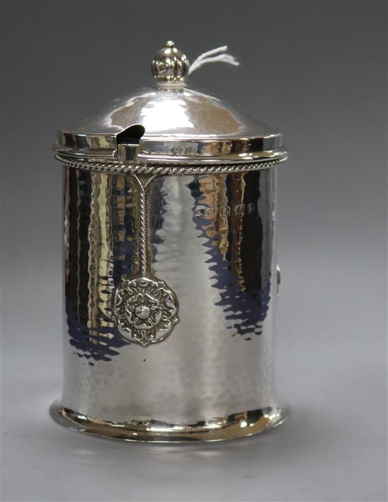 An George V Arts & Crafts planished silver preserve jar and cover by Albert Edward Jones, Birmingham, 1924, height 12.6cm.